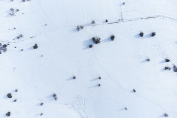 aerial landscape with a field covered with snow