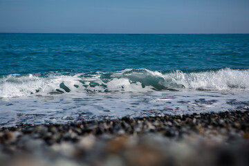 Light blue sea wave near the shore