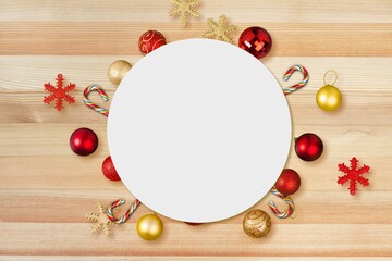 Christmas round with holiday decorations and frame for text on yellow background