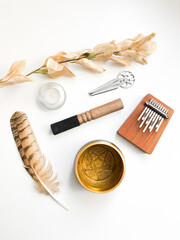 Ethnic musical background, Tibetan musical instruments on a white background, top view.place for text