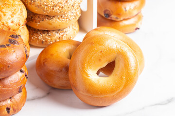 Stacks of Various Flavors of Bagels on a Counter