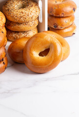 Stacks of Various Flavors of Bagels on a Counter