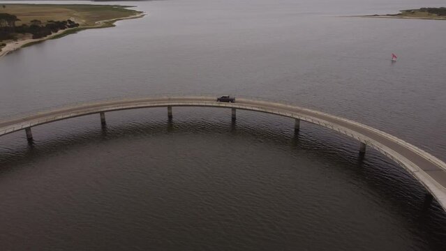 Drone follows a truck crossing the Laguna Garzon bridge