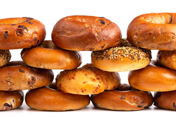 A Variety of Different Bagel Flavors on a White Background