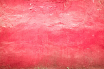 Fototapeta premium Pink colored grunge cement wall texture background.