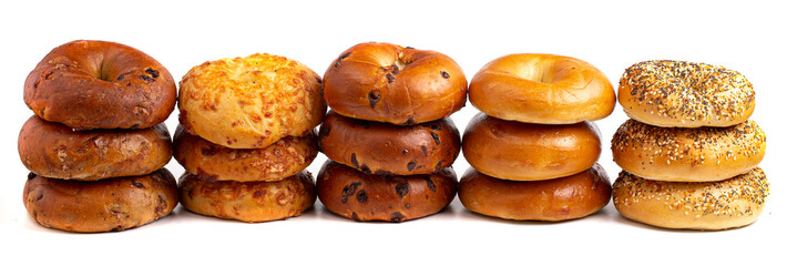 A Variety of Different Bagel Flavors on a White Background