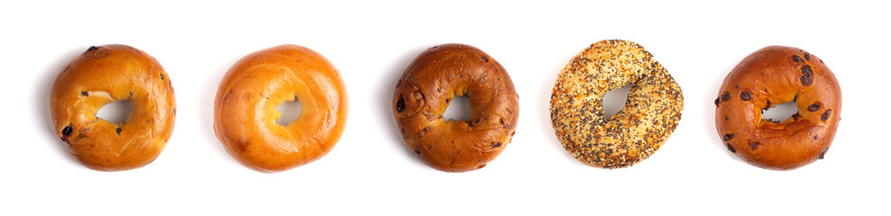 A Row of Five Different Types of Bagels Isolated on a White Background - obrazy, fototapety, plakaty