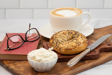 An Everything Bagel Coffee and Book for Breakfast