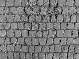 black and white photo of square paving stones