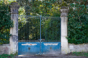 blue old vintage portal style metal driveway entrance gate access entry