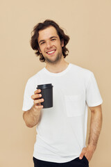 Attractive man with a black glass in a white t-shirt isolated background