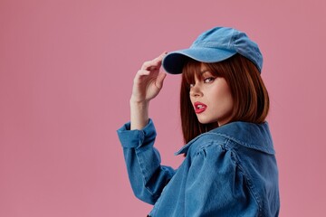 Naklejka premium pretty woman denim clothing fashion posing cap color background unaltered