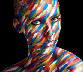 Naklejka premium Colourful beauty. Cropped portrait of a young woman posing with paint on her face.