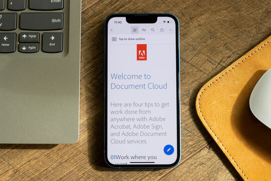 Portland, OR, USA - Feb 5, 2022: Welcome to Document Cloud PDF is seen in the Adobe Acrobat Reader app on an iPhone. The app lets users view, comment, fill out, sign PDF forms to facilitate workflow.