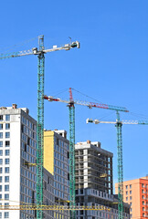 Crane and highrise construction site