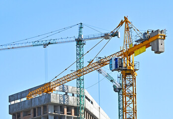 Crane and highrise construction site