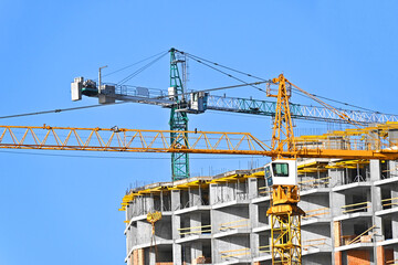 Crane and highrise construction site
