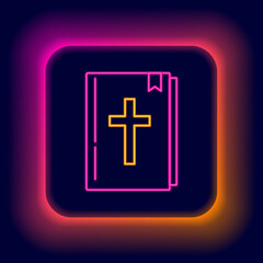 Fototapeta premium Glowing neon line Holy bible book icon isolated on black background. Colorful outline concept. Vector