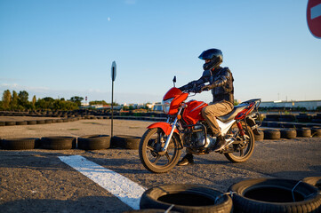 Student on motorbike at starting line, motordrome