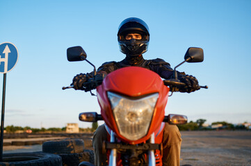 Fototapeta na wymiar Man on motorbike, front view, motorcycle school