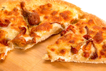 Food concepts. Part Closeup View of Traditional Freshly Baked Cheese and Mushrooms Pizza On Woden Plate.