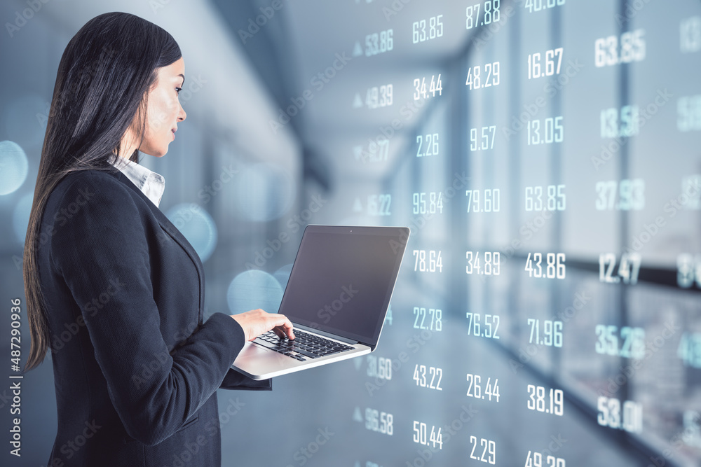 Poster pretty young european businesswoman typing on blank mock up screen laptop keyboard in blurry office 