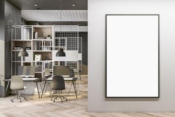 Blank white poster in black frame with copyspace for your logo on light wall in co-working office with modern design workspaces, light parquet floor, metallic decorated partitions. 3D rendering