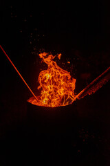 fire burning in an outdoor fireplace