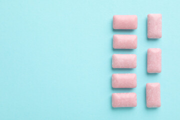 Chewing gum on blue background, space for text