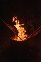 fire burning in an outdoor fireplace