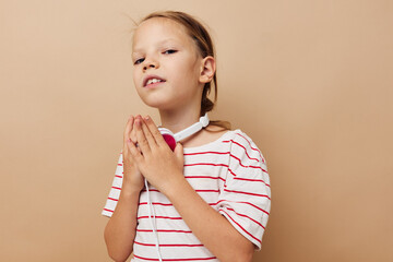 Portrait of happy smiling child girl headphone technology fun music Lifestyle unaltered