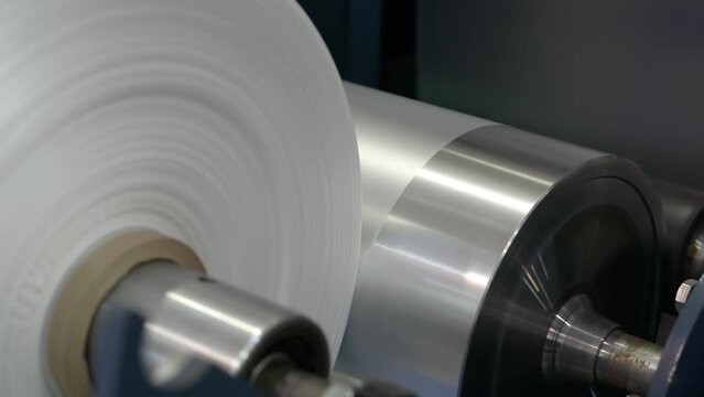 Roll of rotating polyethylene film close-up.