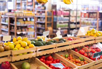 Showcase with fresh organic vegetables and fruits in supermarket