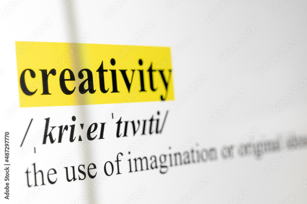 Poster creativity text macro shot highlighted in yellow color on computer screen