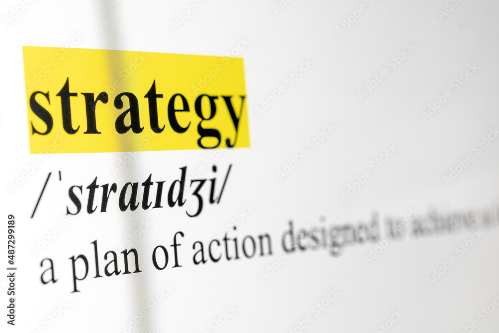 Poster Strategy Text Macro Shot Highlighted in Yellow Color On Computer Screen