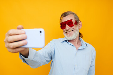 elderly man fashion red glasses phone selfie technology