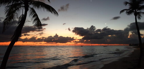 Sunrise on the Beach. Rising sun, Ocean and Cloudy Sky