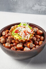 Appetizer with crab meat, edamame beans and creamy sauce. Fine dining: Tartlet with crab. Seafood appetizers in modern dishware. Delicious starters from innovative chef recipes.
