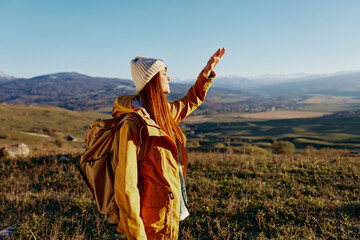 woman backpacking trip to mountains landscape relaxation