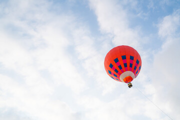 Blue air balloon flying in the clear blue sky