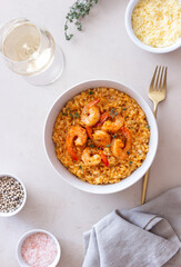 Risotto with shrimps, tomatoes and thyme. Italian food.