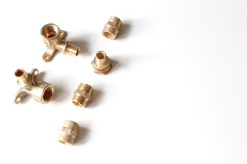 Plumbing faucet and brass fittings on the white background repairing or replacing different equipment