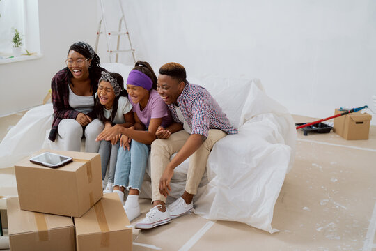 The Family Bursts Out Laughing, Joking, Sense Of Humor, Hanging Out In The Renovated Apartment On The Couch Protected By Foil, Failed Attempt To Take A Picture