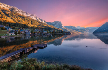 Fantastic Colorful Landscape. View on Fairy-tale lake in Alpine mountains. Picturesque sky over the lake. Grundlsee lake. Picture of wild area, retro filter. Creative image