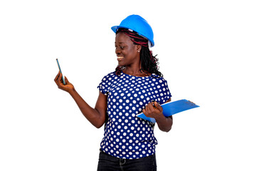 young female engineer holding clipboard and taking photo with mobile phone.