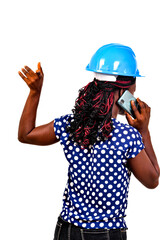 portrait of a beautiful female engineer talking on the cellphone.