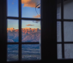 church in fresh frosty evening sun in winter mountains of the slovenian alps at sunset