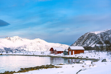 Cabins on the island with snow mountain, in Tromsø Norway