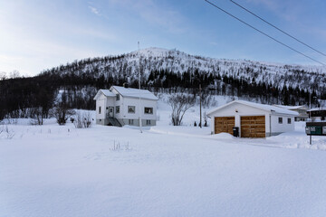 Cabins on the island with snow mountain, in Tromsø Norway