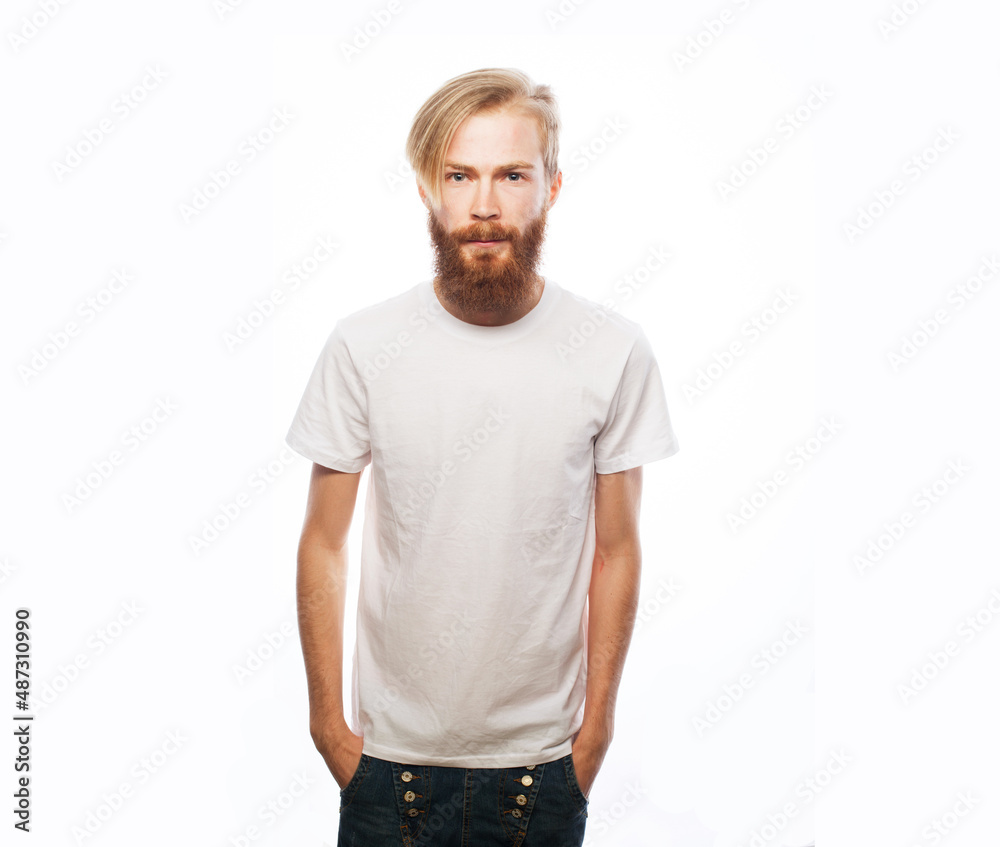 Wall mural Portrait of young handsome hipster man with red beard looking at camera